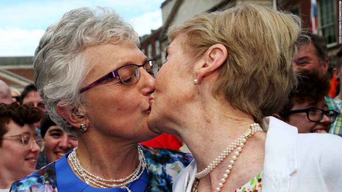 Sen. Katherine Zappone kisses Ann Louise Gilligan on Saturday, May 23, at the central count station at Dublin Castle, Dublin, after Zappone proposed live on televison. By a solid majority, Ireland became the first country in the world to legalize same-sex marriage by popular vote.
