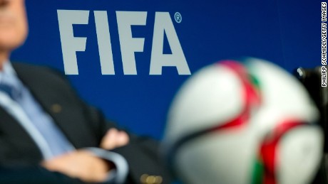 Caption:ZURICH, SWITZERLAND - MARCH 20: A FIFA logo sits on a wall behind FIFA President Joseph S. Blatter during a press conference at the end of the FIFA Executive Comitee meeting at the FIFA headquarters on March 20, 2015 in Zurich, Switzerland. (Photo by Philipp Schmidli/Getty Images)
