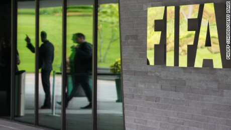 A FIFA logo sits next to the entrance to the FIFA headquarters on May 27, 2015 in Zurich, Switzerland. Swiss police on Wednesday raided a Zurich hotel to detain top FIFA football officials as part of a US investigation into corruption.