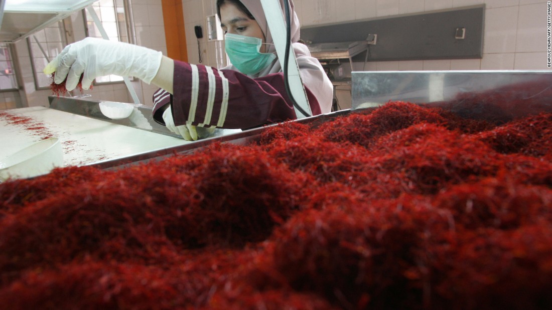 A worker sorts and cleans saffron filaments at Iran&#39;s Novin Saffron factory in Touss industrial zone in Mashhad.