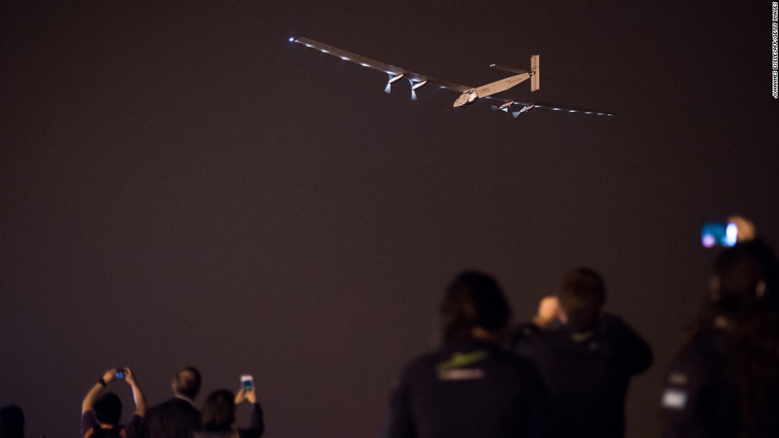 People take pictures as the plane takes off from Nanjing, China, on Sunday, May 31.