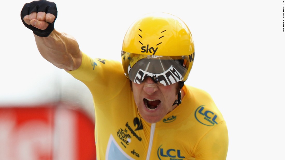 Wiggins punches the air after winning the stage 19 time trial at the 2012 Tour de France.