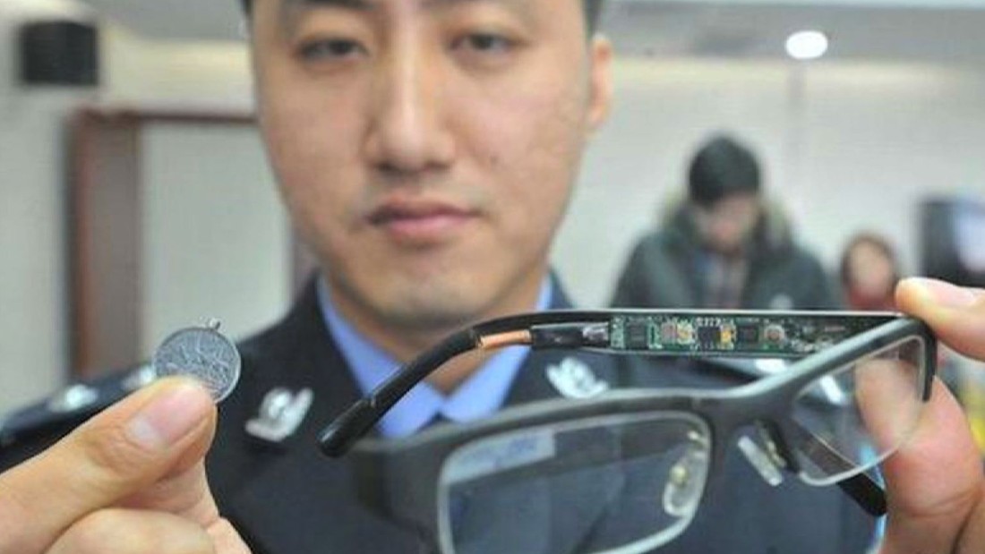 The stakes are so high some students have stooped to ingenious methods of cheating.  A police officer displays a device used by students to cheat in previous years.