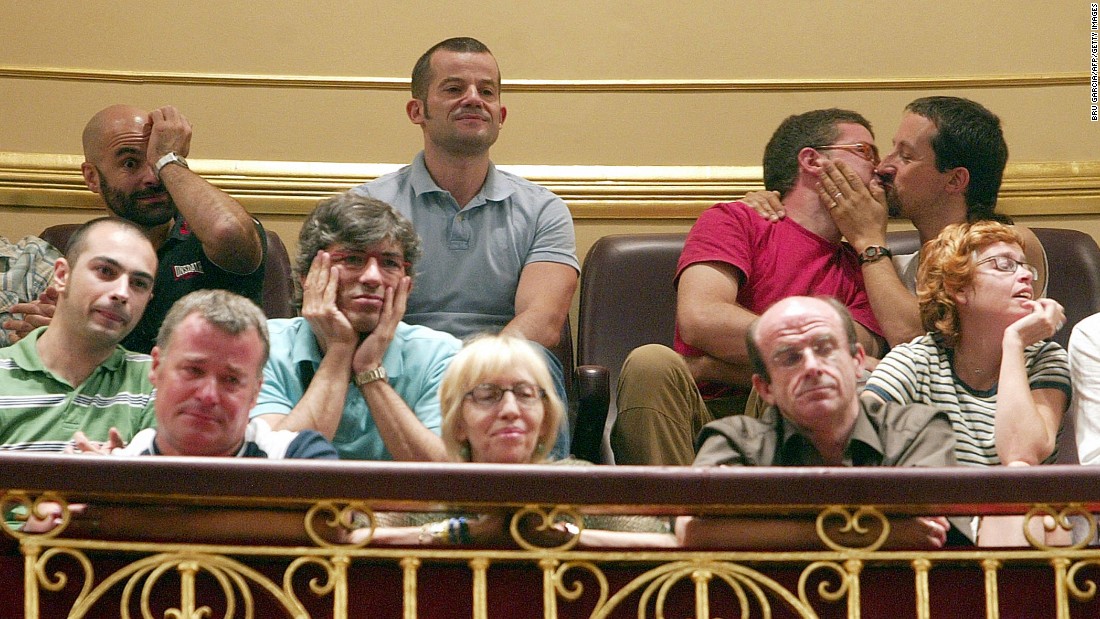 People in Madrid, Spain react to a law allowing same-sex couples to marry and adopt children in Spain in June, 2005.