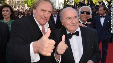 French actor Gerard Depardieu (L) and FIFA President Sepp Blatter give a thumbs-up as they arrive for the screening of the film &#39;United Passions&#39; at the 67th edition of the Cannes Film Festival in Cannes.