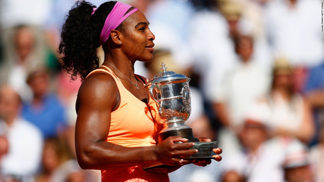 Serena Williams poses on court after triumphing in the 2015 French Open final. 