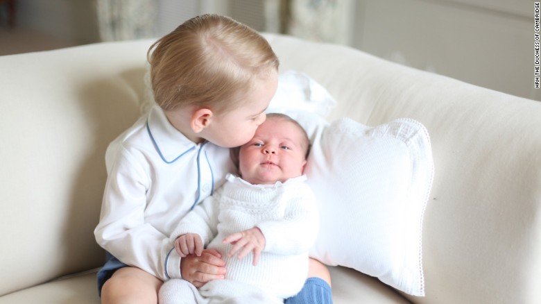 Princess Charlotte is seen with her big brother for the first time in a photo released by Kensington Palace in June 2015.