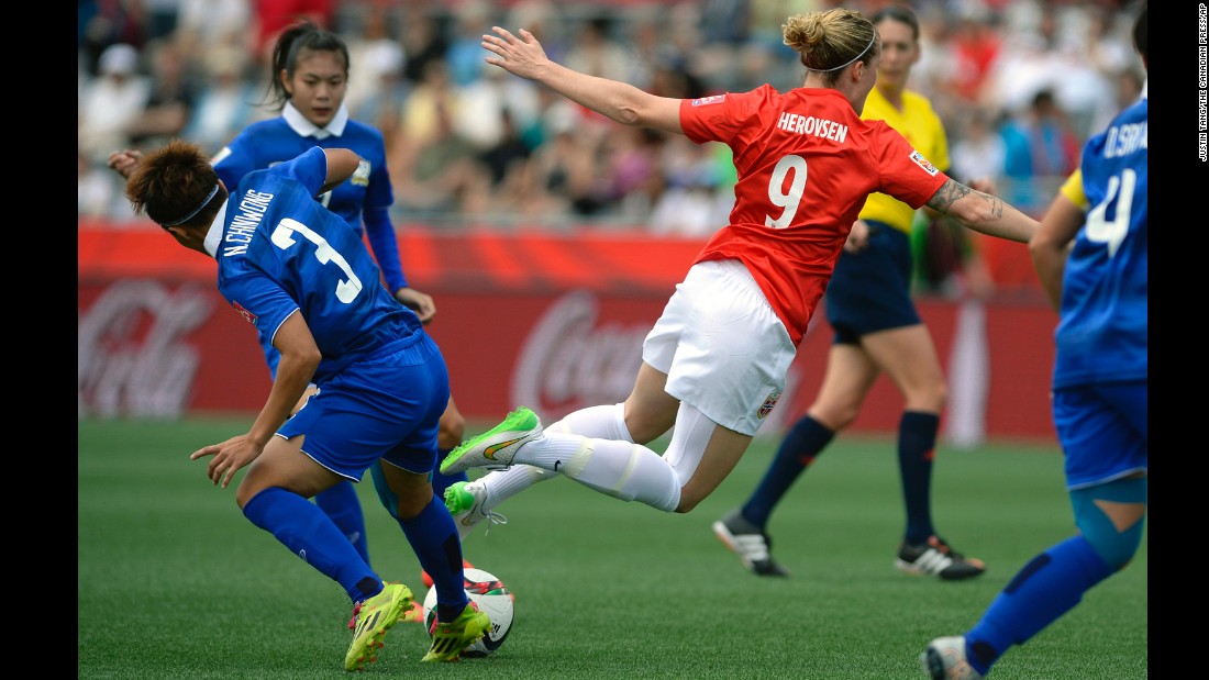 Norway&#39;s Isabell Herlovsen falls after a challenge from Thailand&#39;s Natthakarn Chinwong on Sunday, June 7. Herlovsen scored two goals as Norway defeated Thailand 4-0.