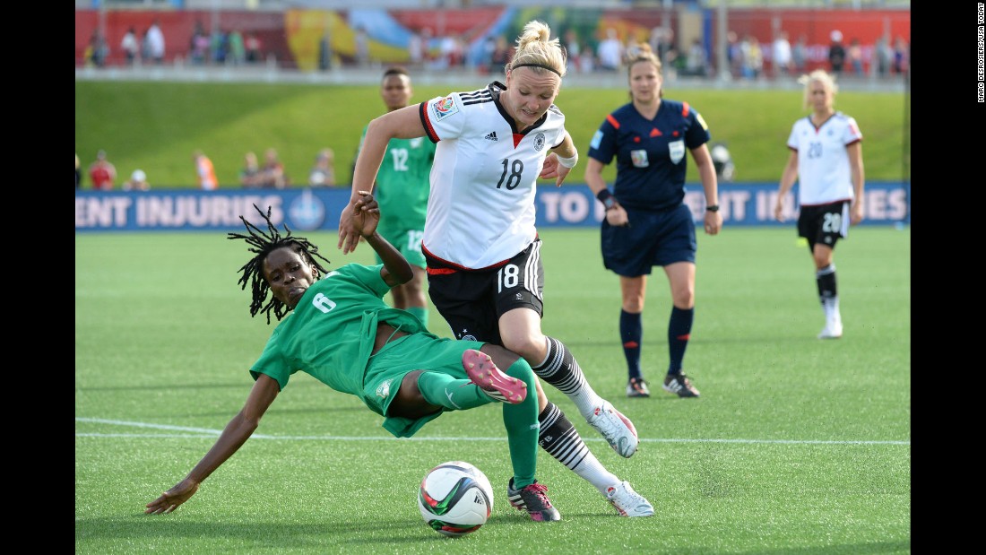 Ivory Coast midfielder Rita Akaffou, left, battles Germany forward Alexandra Popp in the second half of the match. 
