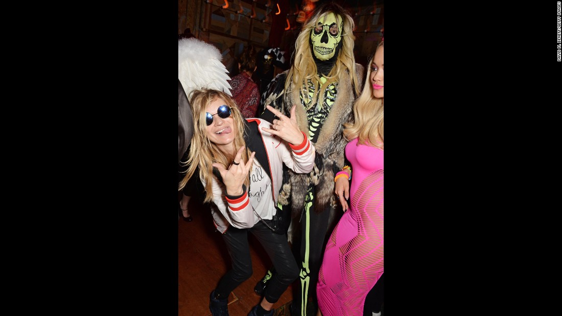 Moss, left, and singer Rita Ora, right, attend a 2014 Halloween party in London.
