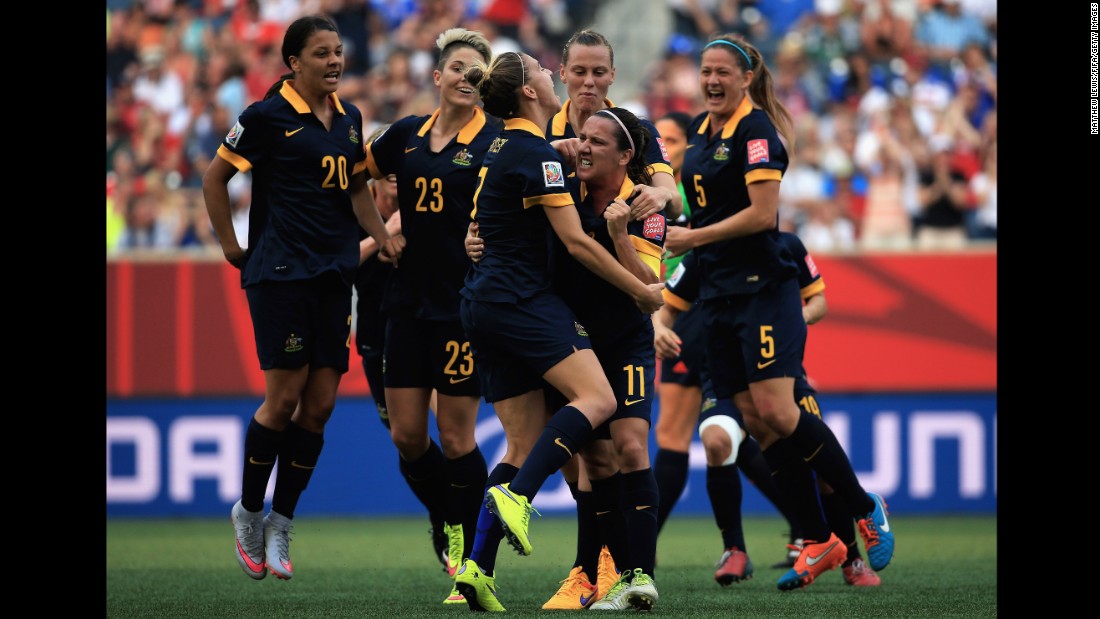 Australia&#39;s Lisa De Vanna celebrates her first-half goal with her teammates.