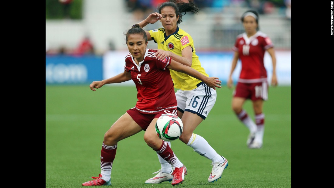 Mexico&#39;s Valerie Miranda, left, and Colombia&#39;s Lady Andrade battle for the ball during a match June 9 in Moncton. The match ended in a 1-1 draw.