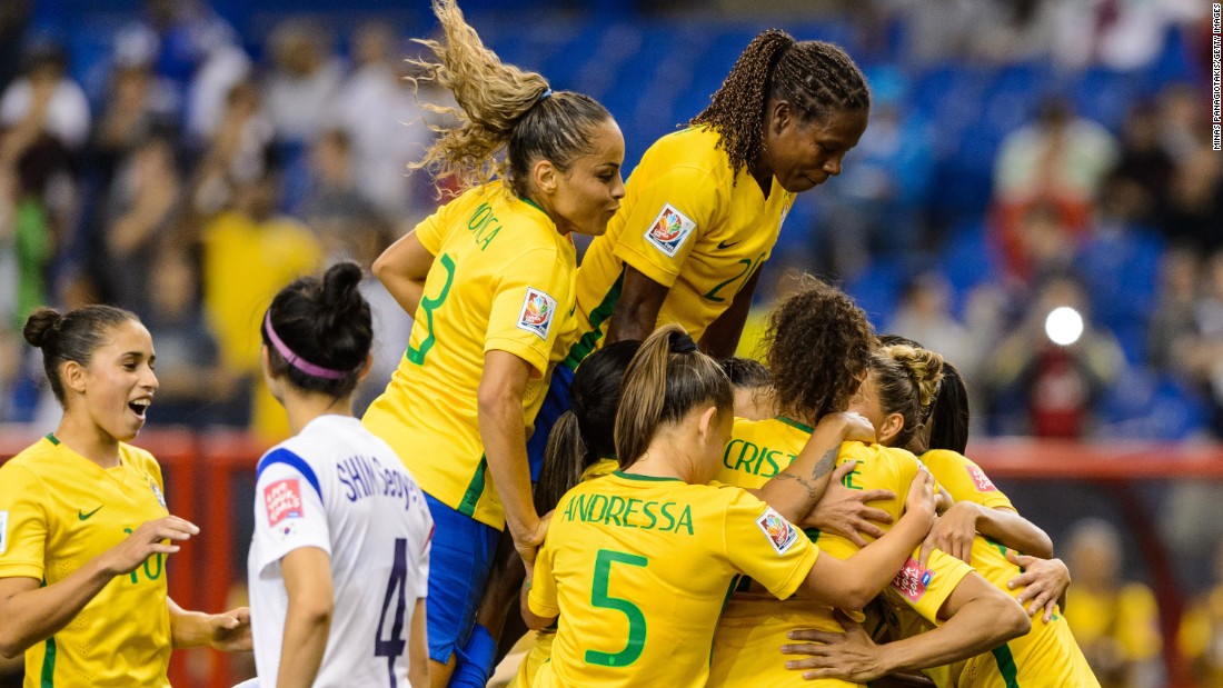 Brazilian players celebrate a goal scored by Marta during their match against South Korea on Tuesday, June 9. Brazil won the match 2-0 in Montreal.