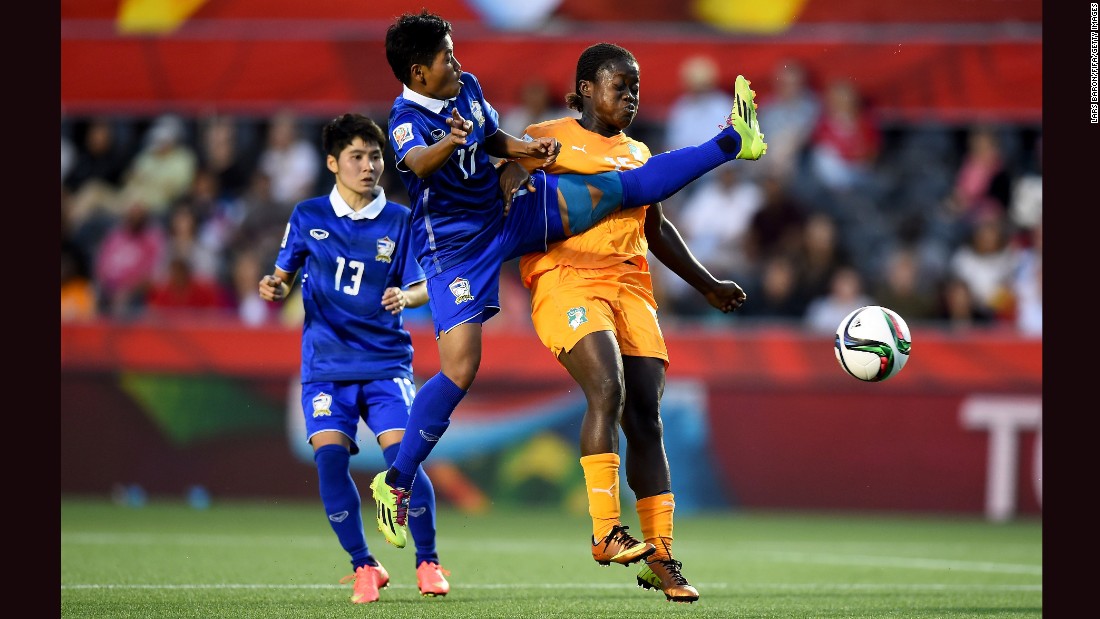 Anootsara Maijaren of Thailand, center, challenges Christine Lohoues of Ivory Coast during a Women&#39;s World Cup match in Ottawa on Thursday, June 11. Thailand won the match 3-2. 