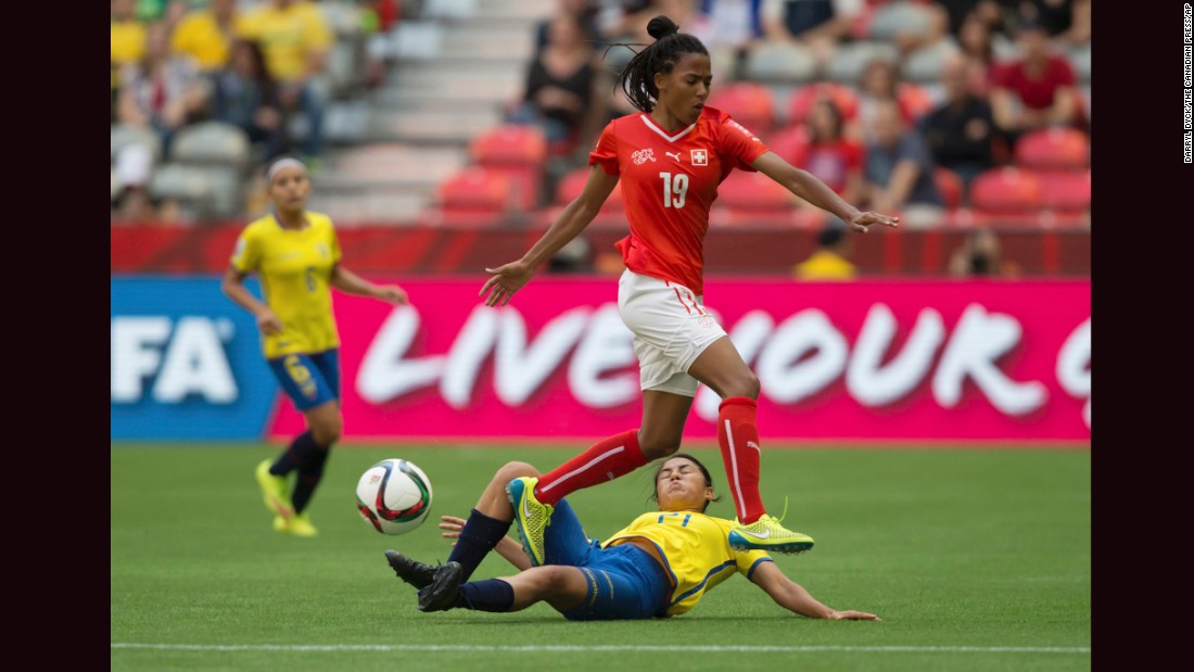 Ecuador&#39;s Mabel Velarde slides to take the ball away from Aigbogun. 