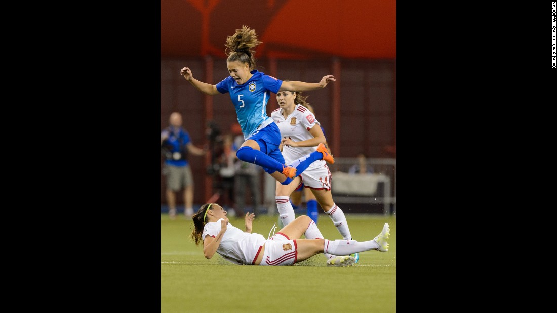 Brazil&#39;s Andressa jumps over Virginia Torrecilla of Spain.