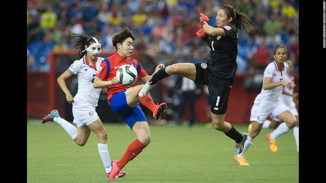 Costa Rica goalkeeper Dinnia Diaz comes out to knock the ball away from South Korea&#39;s Lee Geummin.