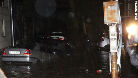 Cars are partially submerged during flooding in Tbilisi, Georgia.n