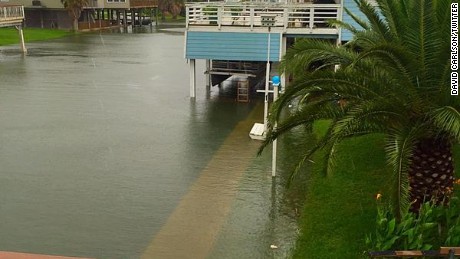 David Carlson shared a photo of the flooding in Jamaica Beach on Galveston Island in Texas on Tuesday morning. He said the storm surge from Tropical Storm Bill had gone over the flood wall.
https://twitter.com/David9683/status/610803552496128001
=