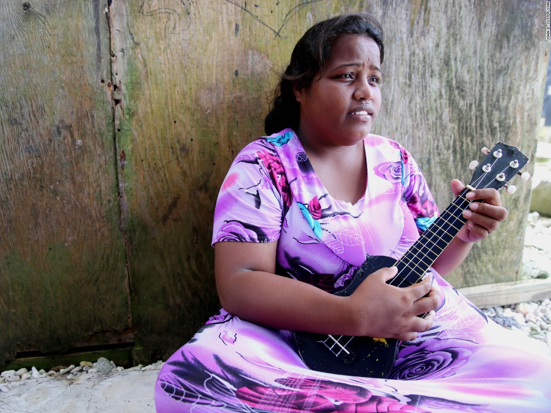 Rositha Anwel, 22, said she woke up to find herself floating during a March 2014 flood. Some neighbors moved away, but Anwel can&#39;t imagine leaving her family&#39;s home on the water. &quot;This is where I grew up,&quot; she said.