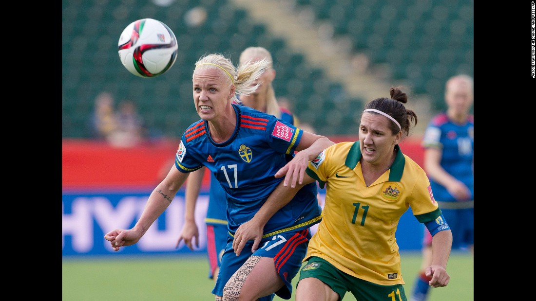 Australia&#39;s Lisa De Vanna, right, and Sweden&#39;s Caroline Seger watch the ball.