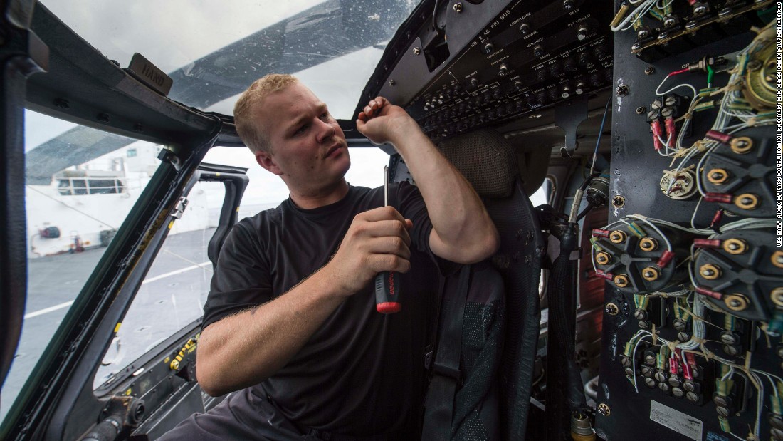 The Comfort carries engineers as well as medical staff. Pictured, an aviation electronics technician conducts maintenance inside the ship&#39;s MH-60S Sea Hawk helicopter.