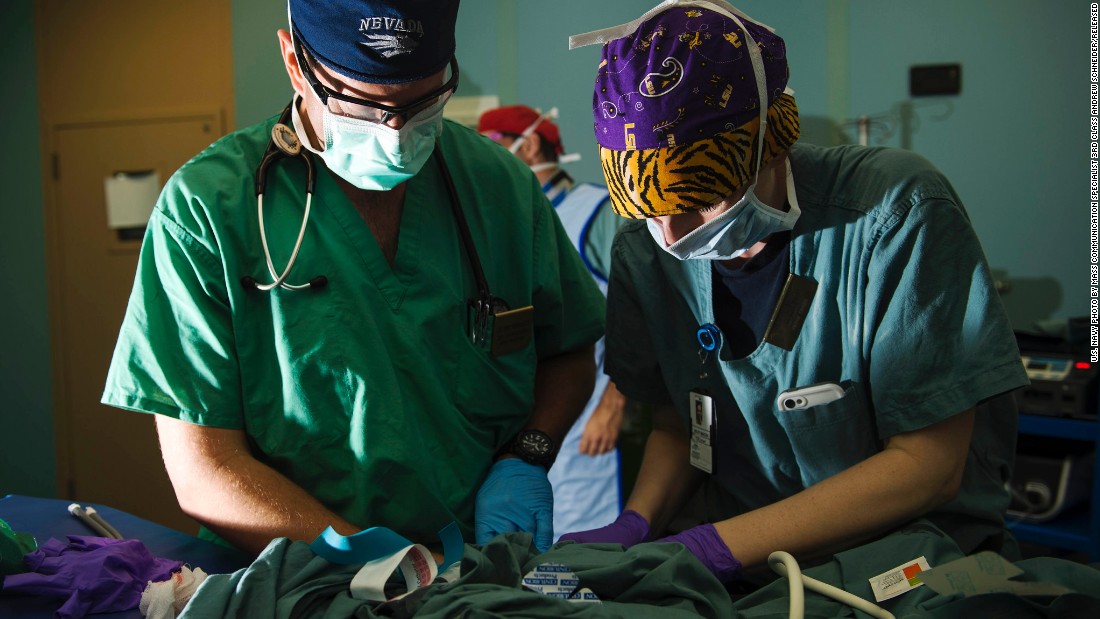 An anesthetist and a peri-operative nurse prepare a Guatemalan child for surgery on board the ship.