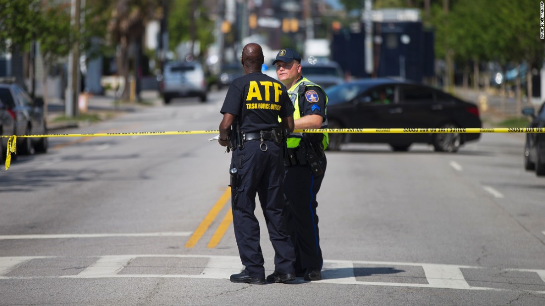 Law enforcement officers in Charleston, South Carolina, stand guard near the scene of the shooting at Emanuel African Methodist Episcopal Church.