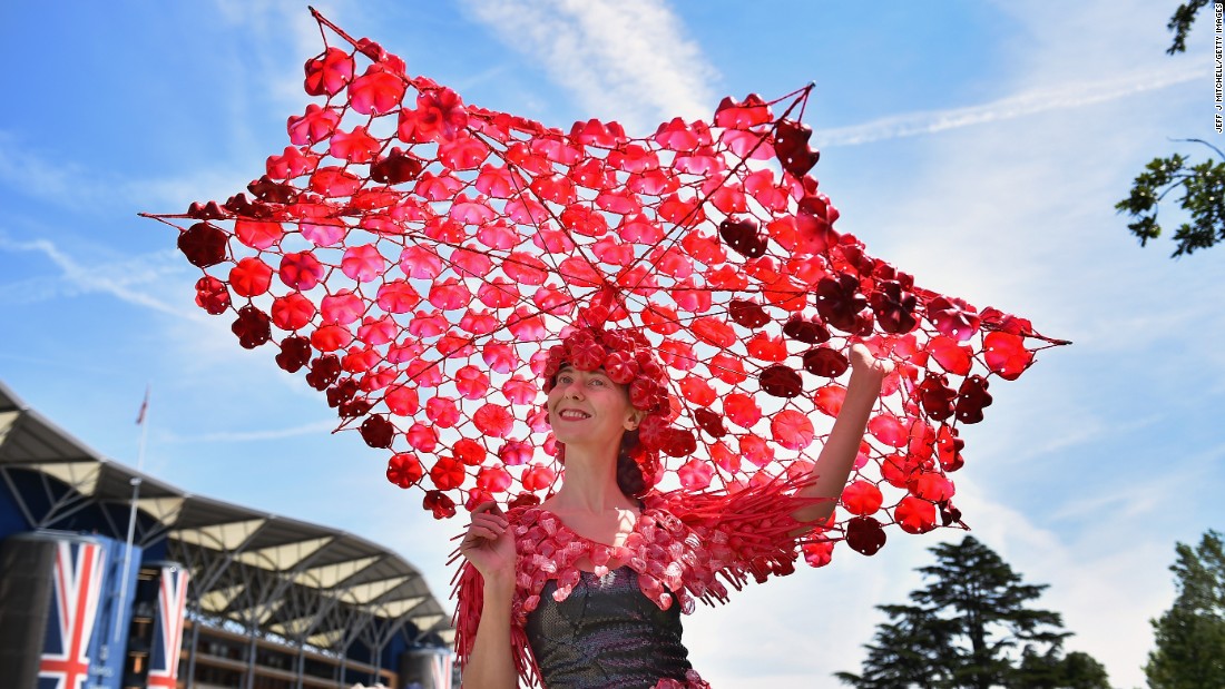&quot;The ladies go to a hell of a lot of effort on Ladies&#39; Day,&quot; says horse racing journalist Oliver Brett, who attempted to seek shade under this fantastically large creation.