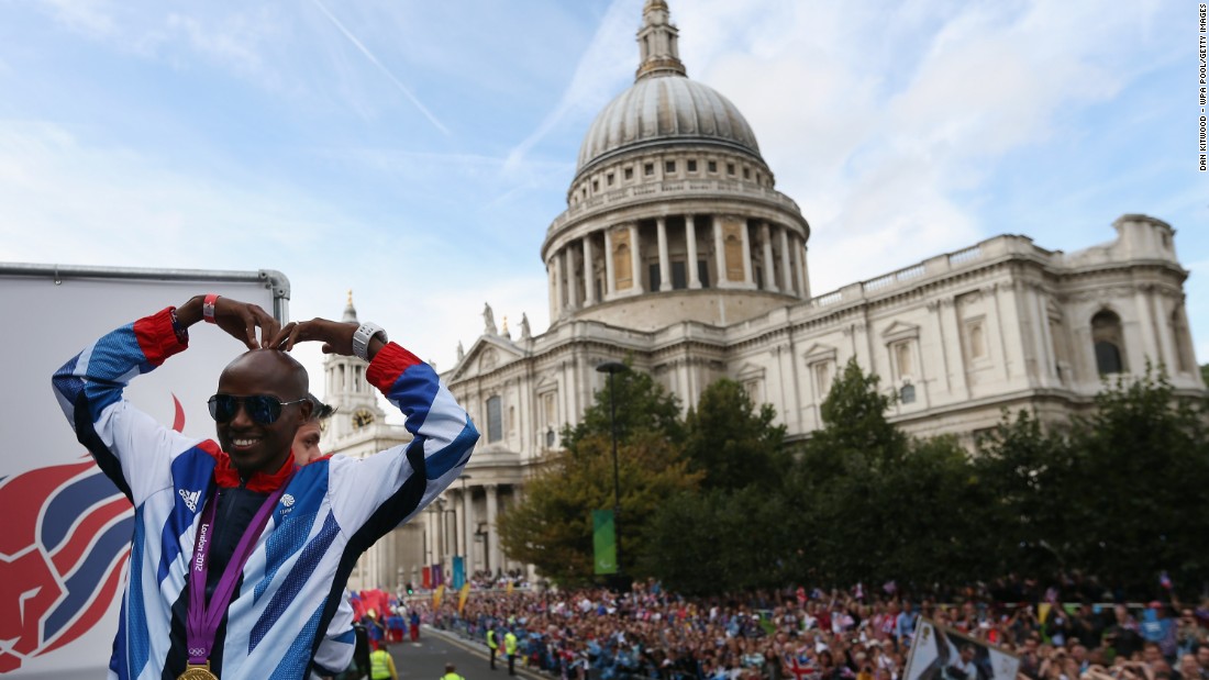 Farah recreates his &quot;Mobot&quot; celebration during the London 2012 Victory Parade on September 10, 2012 in front of St Paul&#39;s Cathedral. 