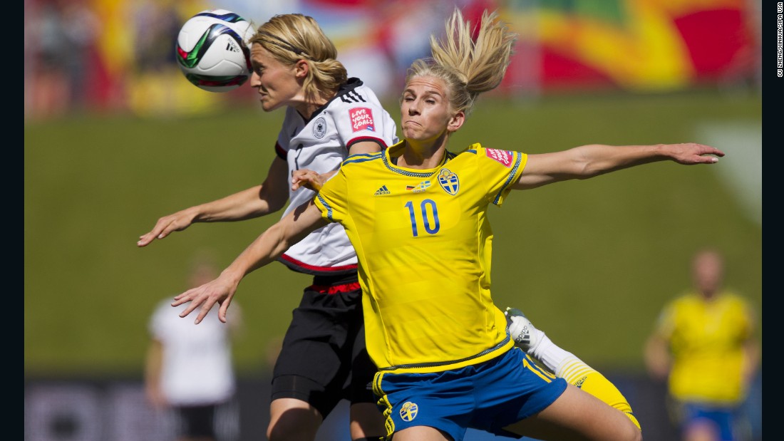 Germany&#39;s Saskia Bartusiak, left, collides with Sweden&#39;s Sofia Jakobsson during a round-of-16 match in Ottawa on June 20. Germany won 4-1 to advance to the quarterfinals. 