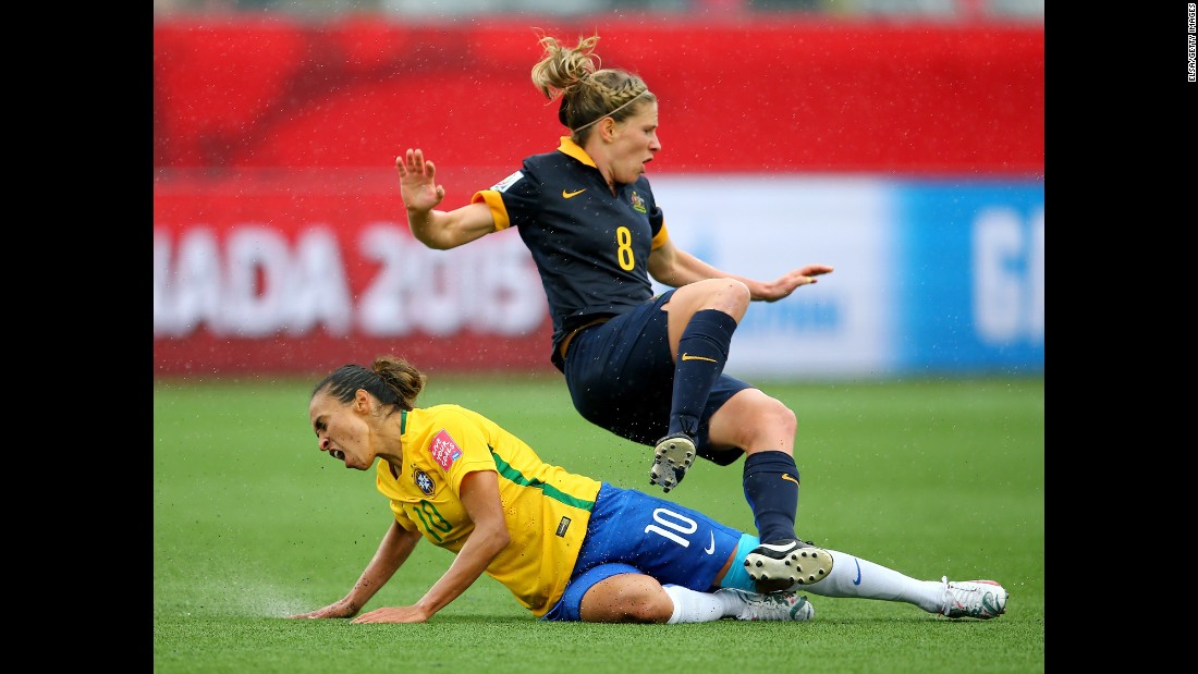 Brazil&#39;s Marta slides into Elise Kellond-Knight.