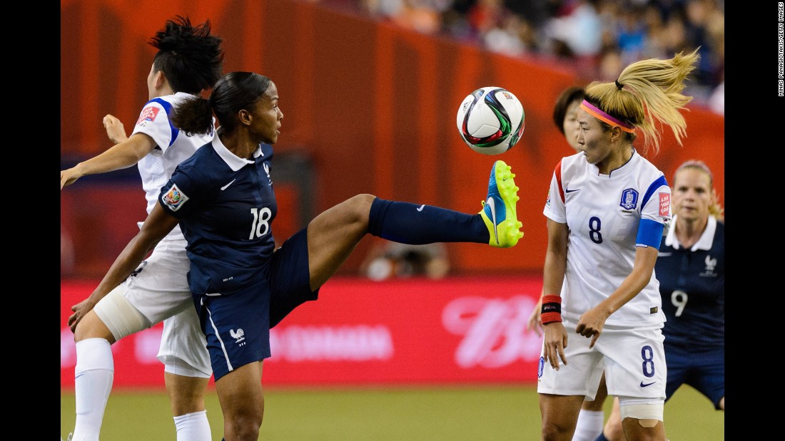 Marie Laure Delie of France kicks the ball in front of Cho So-hyun of South Korea during a round-of-16 match June 21 in Montreal. France won 3-0.