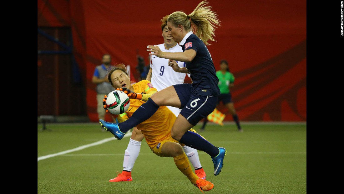 South Korean goalkeeper Kim Jung-mi makes a save against France&#39;s Amandine Henry during the first half.