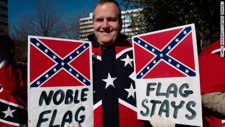 Dr. John Cobin of Greenville, South Carolina holds signs in support of displaying the Confederate flag at a Martin Luther King Day rally January 21, 2008 in Columbia, South Carolina.
