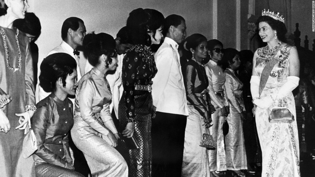 The Queen&#39;s first visit to Thailand shows her here visiting the Grand Palace in Bangkok in February 1972. 