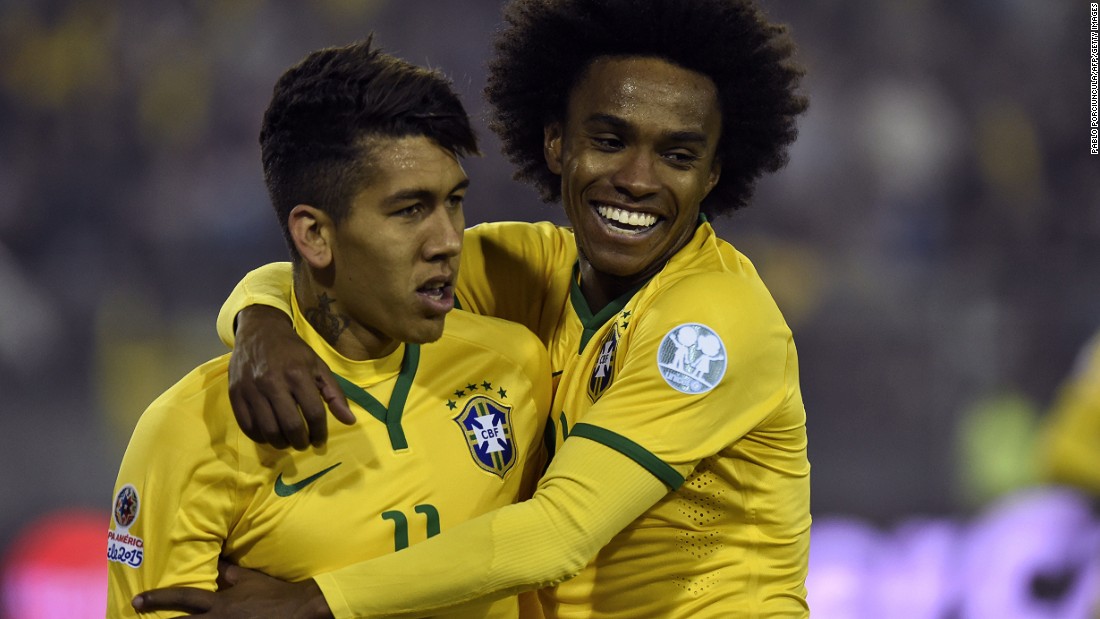 Firmino (left) is congratulated by his teammate Willian after scoring the winning goal against Venezuela in the Copa America. Liverpool have signed the 23-year-old for around $45 million from German Club Hoffenheim.
