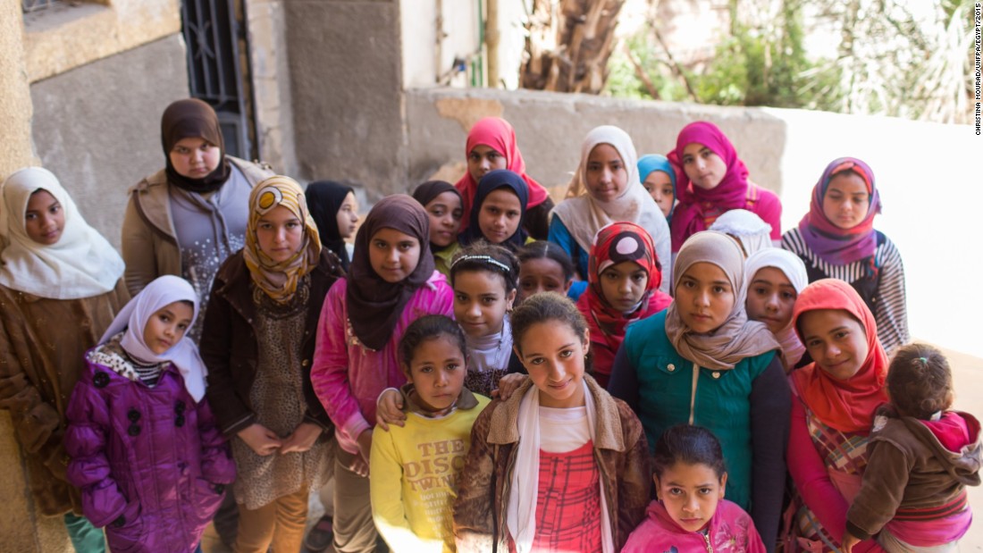 U.N. agencies have adopted a school-based model to try to educate girls about the procedure. Here, in a photo provided to CNN by the UNFPA, a group of girls stand outside the Society of Islamic Center near Sohag on January 31. 
