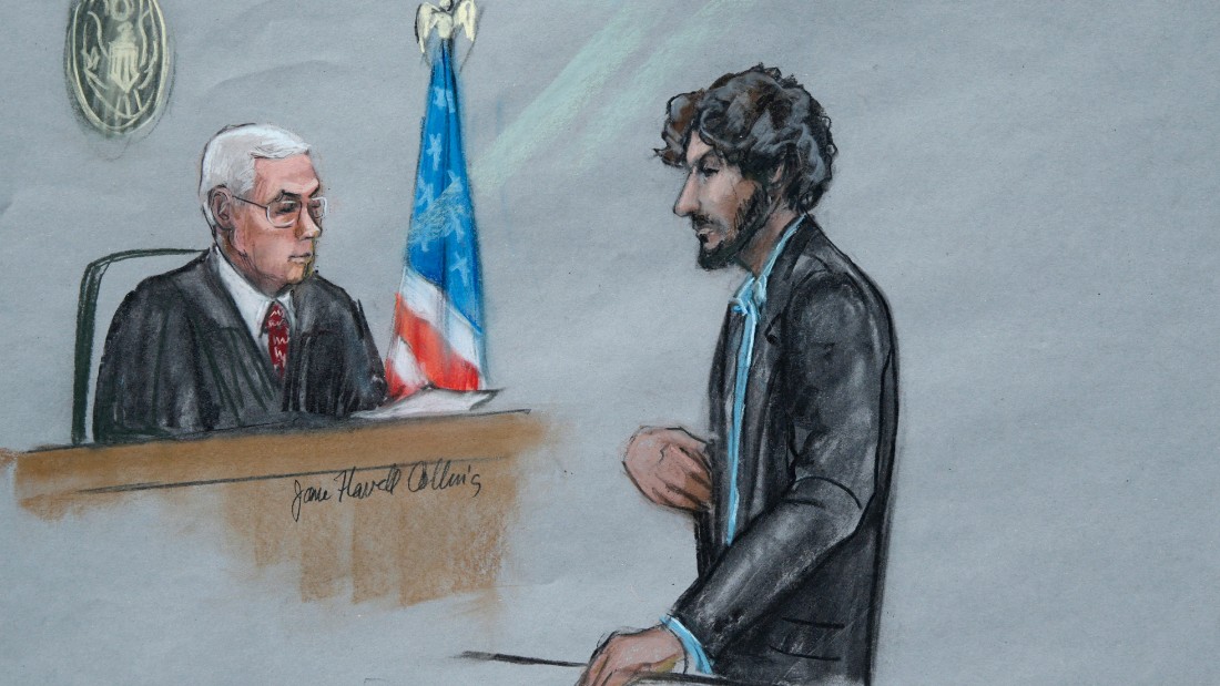 In this courtroom sketch, Boston Marathon bomber Dzhokhar Tsarnaev, right, stands before U.S. District Judge George O&#39;Toole Jr. as he addresses the court during his sentencing, Wednesday, June 24, 2015, in federal court in Boston. Tsarnaev apologized to the victims and their loved ones for the first time Wednesday just before the judge formally sentenced him to death. (Jane Flavell Collins via AP)