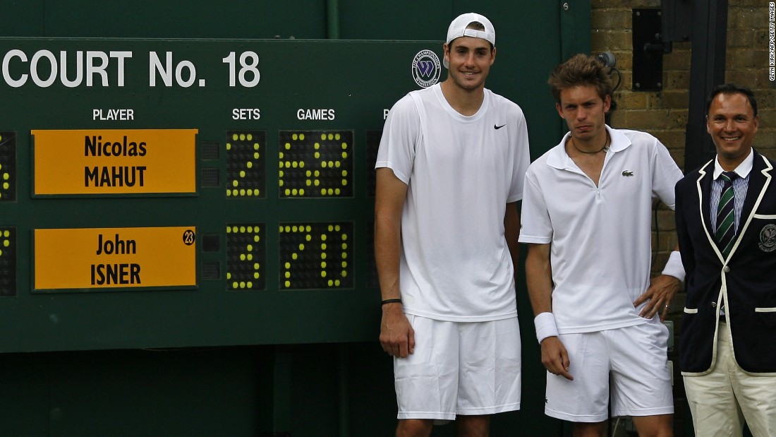 Five years ago at Wimbledon, Nicolas Mahut (center) lost the longest match in tennis history to John Isner (left). 
