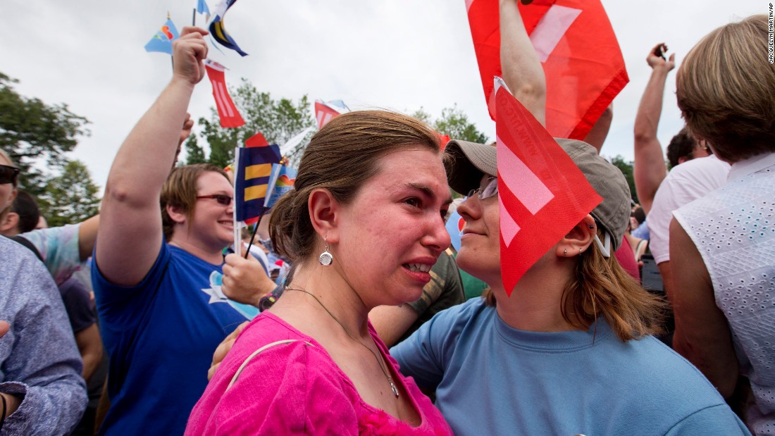 Ariel Olah, left, and her fiancee, Katie Boatman, are overcome by emotion outside the U.S. Supreme Court in Washington on Friday, June 26. 