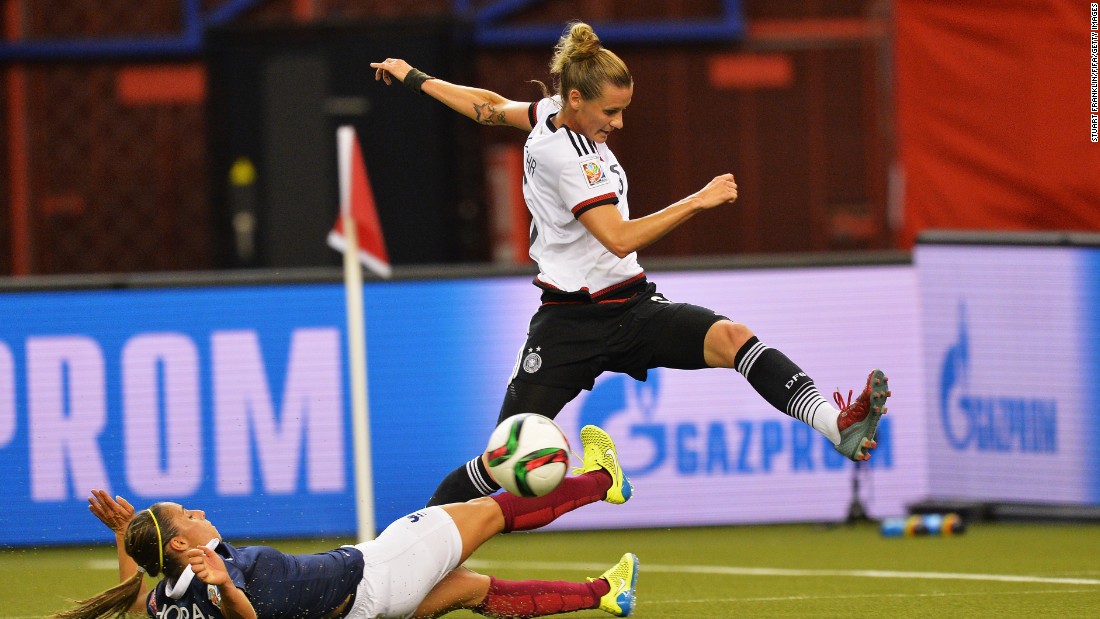 Germany&#39;s Simone Laudehr, right, is challenged by Jessica Houara of France during a quarterfinal match in Montreal on June 26. Germany advanced after winning a penalty shootout.