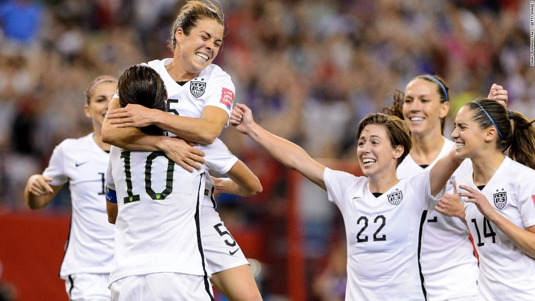 American Kelley O&#39;Hara, top, celebrates with teammates after scoring a goal against Germany on Tuesday, June 30. The goal, late in the second half, clinched a 2-0 semifinal victory for the Americans in Montreal. 