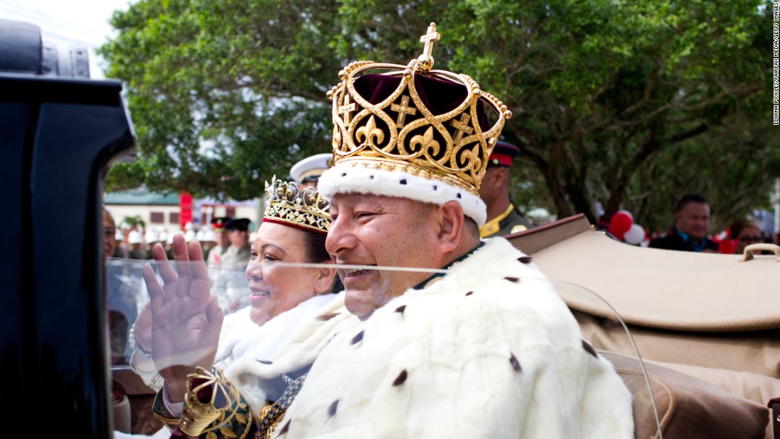 Newly crowned King Tupou VI and his wife, Queen Nanasipau&#39;u, of Tonga proceed through the streets to the Royal Palace as part of the official coronation ceremony on July 4.