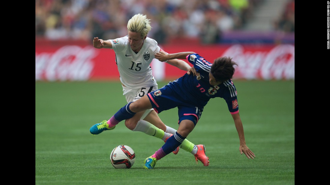 Megan Rapinoe of the United States and Homare Sawa of Japan fight for the ball.