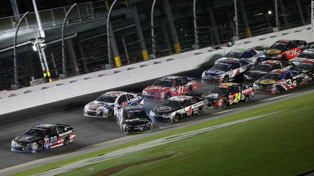 Dale Earnhardt Jr. in the No. 88 Chevrolet crosses the finish line to win as Denny Hamlin in the No. 11 Toyota, begins to lose control and spins.