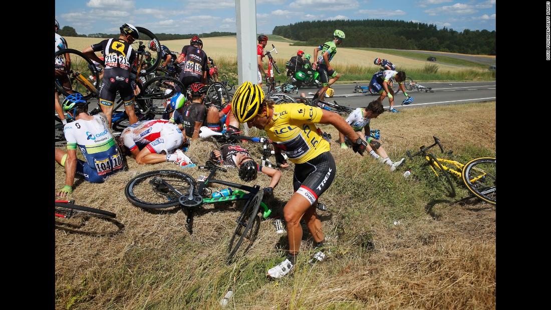 Cyclists recover on the ground after &lt;a href=&quot;http://bleacherreport.com/articles/2515851-huge-crash-takes-out-riders-on-stage-3-of-the-tour-de-france?utm_source=cnn.com&amp;utm_medium=referral&amp;utm_campaign=editorial&quot; target=&quot;_blank&quot;&gt;a massive crash&lt;/a&gt; in the third stage of the Tour de France on Monday, July 6. The man in the foreground, Swiss cyclist Fabian Cancellara, was leading the race, but he had to withdraw after suffering two fractured vertebrae.