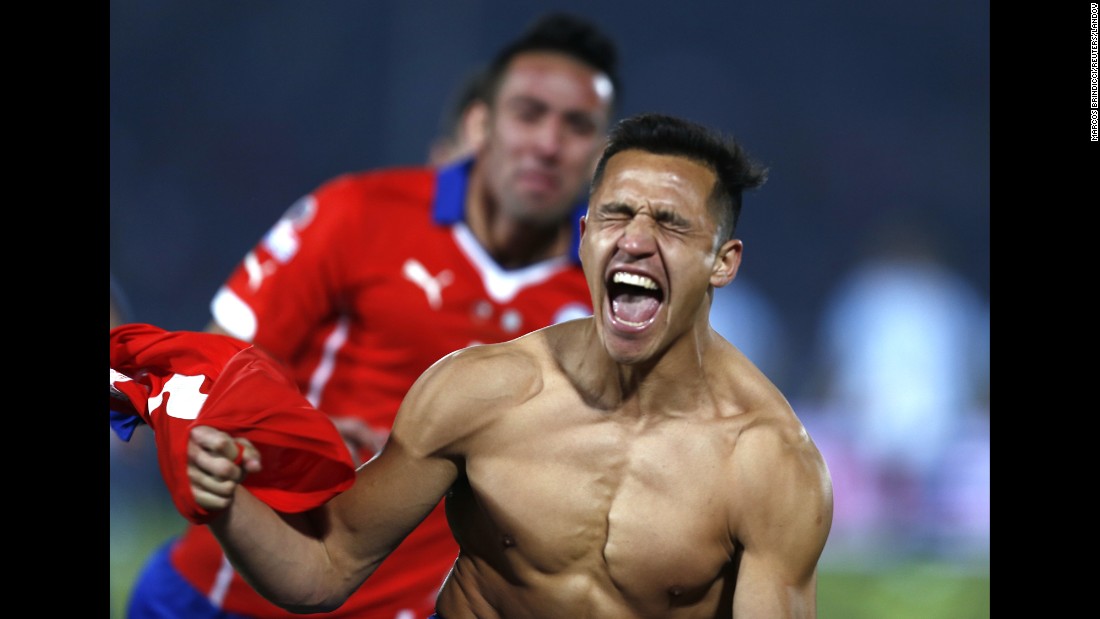 A shirtless Alexis Sanchez celebrates Saturday, July 4, after he scored the winning penalty kick for Chile in &lt;a href=&quot;http://www.cnn.com/2015/07/04/football/football-copa-argentina-chile/&quot; target=&quot;_blank&quot;&gt;the final of the Copa America soccer tournament.&lt;/a&gt; The match against Argentina went to a shootout after ending 0-0 in extra time. It is the first Copa America title for Chile, who hosted this year&#39;s tournament. 
