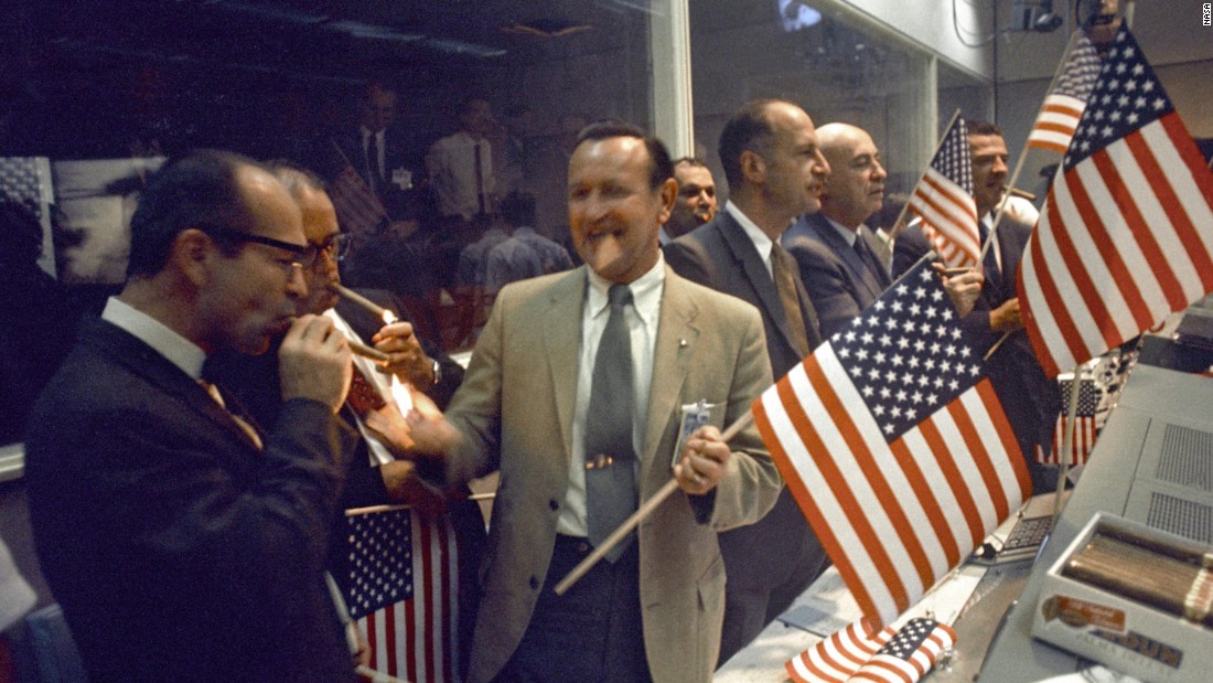 Back on Earth, NASA officials celebrate the successful conclusion of Apollo 11&#39;s eight-day mission.