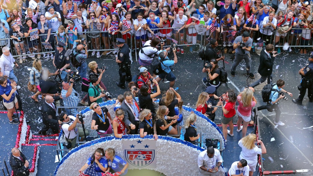 New York Gov. Andrew Cuomo, center, participates in the parade. The U.S. women&#39;s team defeated Japan 5-2 to take its third World Cup title.